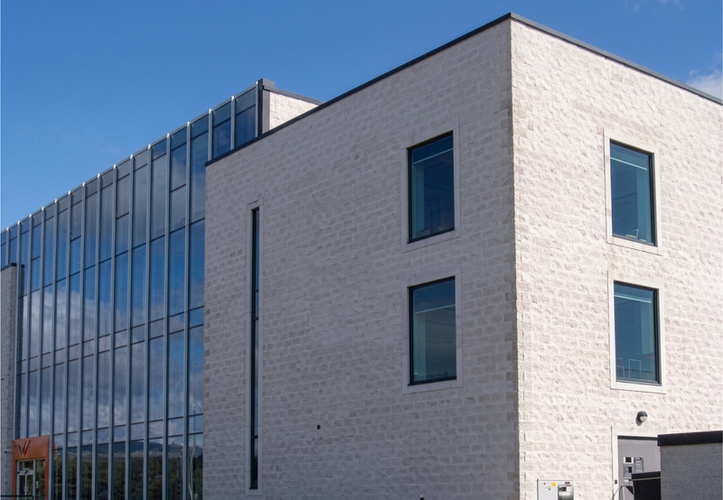 Modern glass and stone exterior of Opalus Office Suites professional managed office spaces.